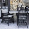Charming wicker outdoor chair in grey with net style design