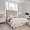 Upholstered linen bed with extravagant headboard