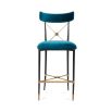 A chic empire-style counter stool in blue velvet fabric 
