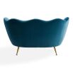 A stylish sofa by Jonathan Adler with a luxury blue upholstery and brass legs