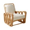 A luxurious rattan and boucle lounge chair by Jonathan Adler