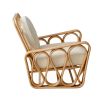 A luxurious rattan and boucle lounge chair by Jonathan Adler