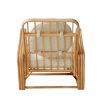 A luxurious rattan and boucle lounge chair by Jonathan Adler