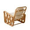 A luxurious rattan and boucle lounge chair by Jonathan Adler