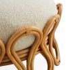 A gorgeous ottoman by Jonathan Adler with a stylish boucle upholstery and sinuous natural framework