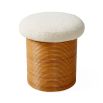 A luxurious cream boucle topped rattan stool
