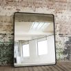 Large, industrial style mirror with black frame