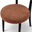 A striking dining chair with a sophisticated design and recycled upholstery
