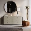 A luxurious matte grey chest of drawers with an iron frame and copper accents