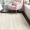 Ivory handwoven rug with loops, knots and basket weave patterns