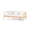 A stylish outdoor sofa from Skyline Design with a dreamy off-white sunbrella upholstery 