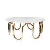 contemporary marble table with a single sinuous brass tube base 