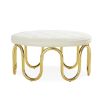 Luxurious circular ottoman upholstered in ivory boucle fabric with polished brass pipe base