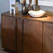 Large orange wood sideboard with two sets of double doors and burled wood finish