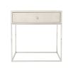 A contemporary side table with a shagreen-embossed leather top and nickel base