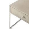 A contemporary side table with a shagreen-embossed leather top and nickel base