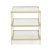 A glamorous gold end table by Caracole with a mid-century modern appeal