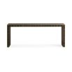 A luxury console table by Caracole with a glamorous gold border