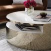 A chic coffee table by Caracole with a glamorous gold finish 