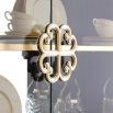 A luxury display cabinet from Caracole with glamorous gold details