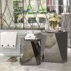A bold and beautiful side table by Caracole with a geometric shape and bronze finish