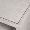 White tv unit with square wood inlay and brass details