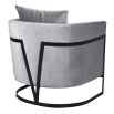 Sleek armchair with black frame and soft grey upholstery