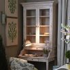 White washed wood cabinet with desk