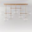 Natural brass finish industrial style chandelier with hanging clear glass globes
