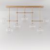 Natural brass industrial style chandelier with hanging clear glass globes