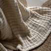 Beige crinkle stripe bedspread