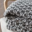 Chunky knitted moss stitched throw in grey