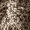 Chunky knitted moss stitched throw in oatmeal