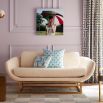 boucle upholstered sofa with a polished brass base 
