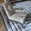 Shop the Cocteau Slipper Chair for elegant comfort. Its chic design and plush upholstery make it a perfect addition to any stylish interior.