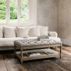 Wooden coffee table with grey upholstered table top