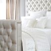 Luxury deep buttoned bed with silver studding and dark feet