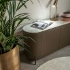 Brown rounded sideboard with marble top