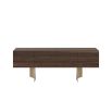 Deep brown sideboard with sculptural brass legs