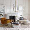 White cream boucle chaise longue with brass legs