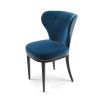 Deeply curved dining chair with studding and buttons