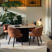 Cosmopolitan-style circular marble dining table with wooden base