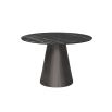 Round and tapered dining table with artisanal central leg