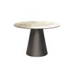 Round and tapered dining table with artisanal central leg