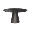 Round and tapered dining table with artisanal central table leg