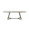 A luxury dining table by Dome Deco with a ceramic table top and curved metal base