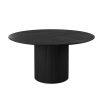 Black round dining table with ribbed plinth base