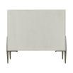 White wooden bedside table with textured cast metal base