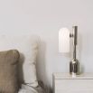 A dazzling polished nickel table lamp with triplex opal glass