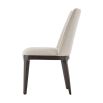 A sophisticated dining chair with a grey upholstery, plush seat and dark tapered legs